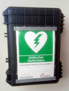 Close up of Defibrillator mounted on front door